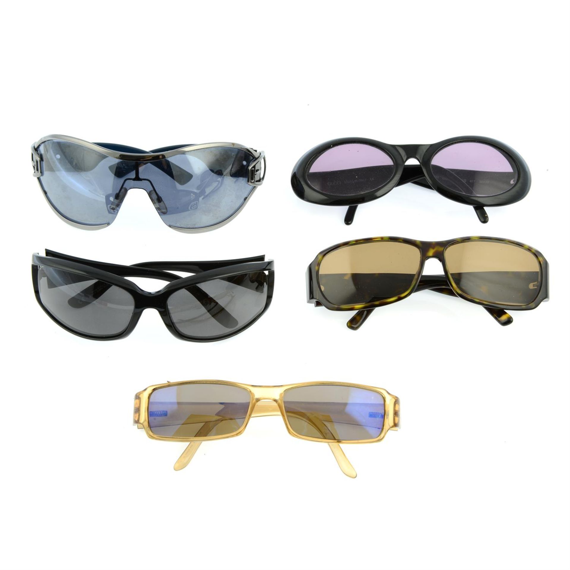 GUCCI - three pairs of sunglasses and two pairs of prescription sunglasses.