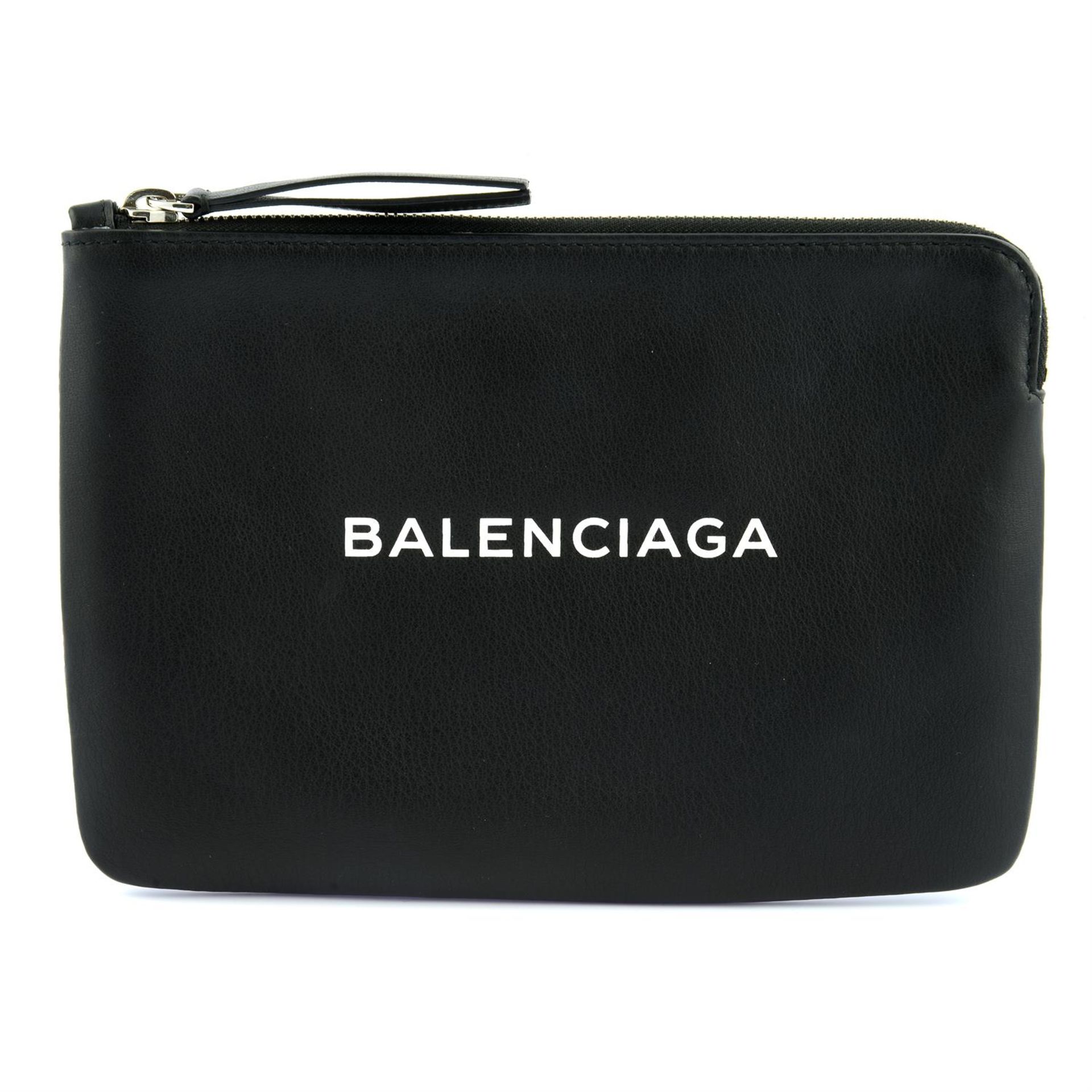 BALENCIAGA - a black leather clutch bag.