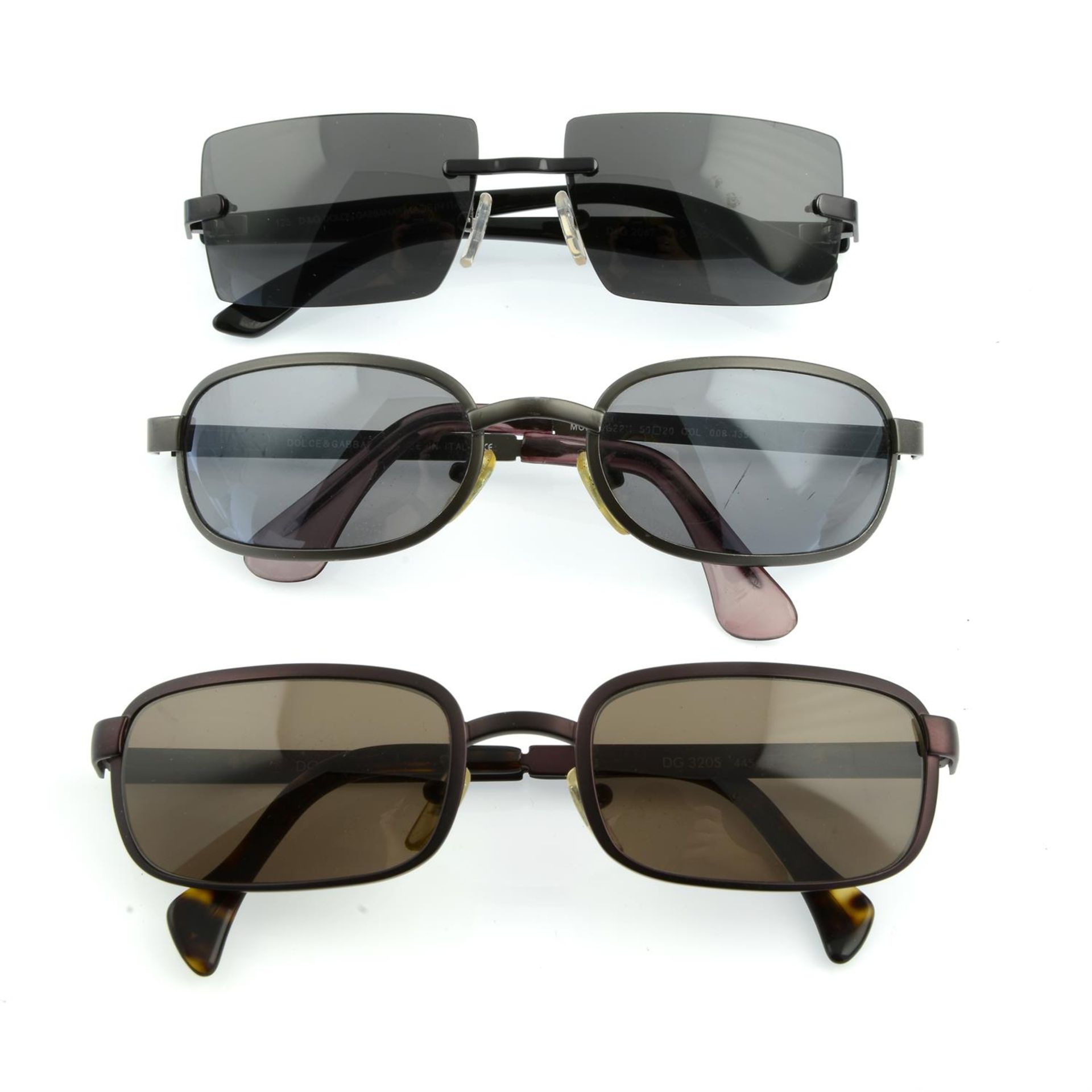 DOLCE & GABBANA - three pairs of sunglasses.