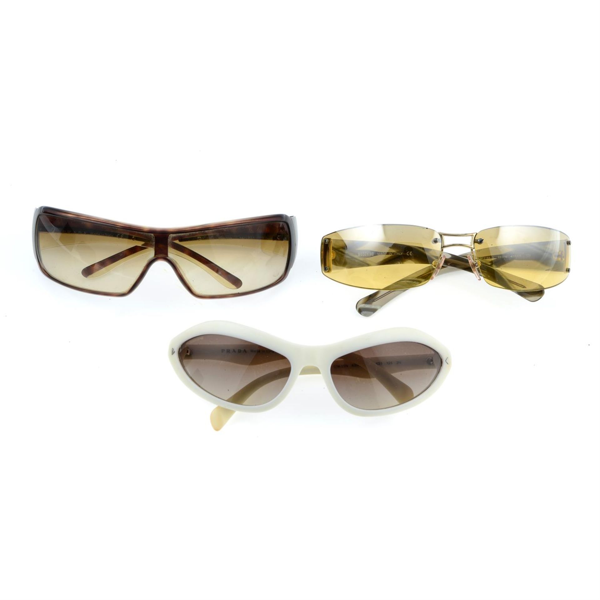 PRADA - three pairs of sunglasses.