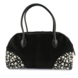 ALAÏA - a studded black Pony fur holdall.