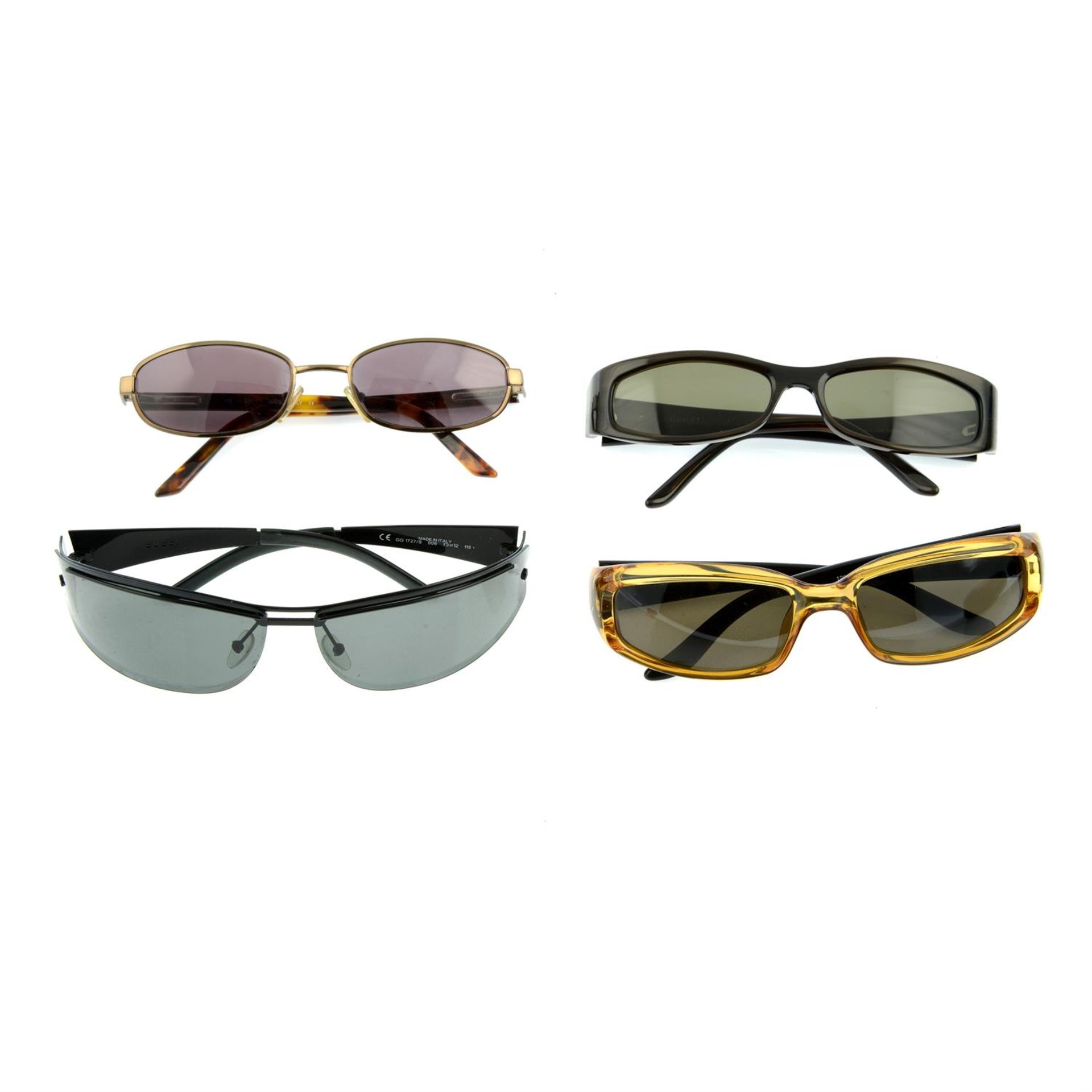 GUCCI - four pairs of sunglasses.