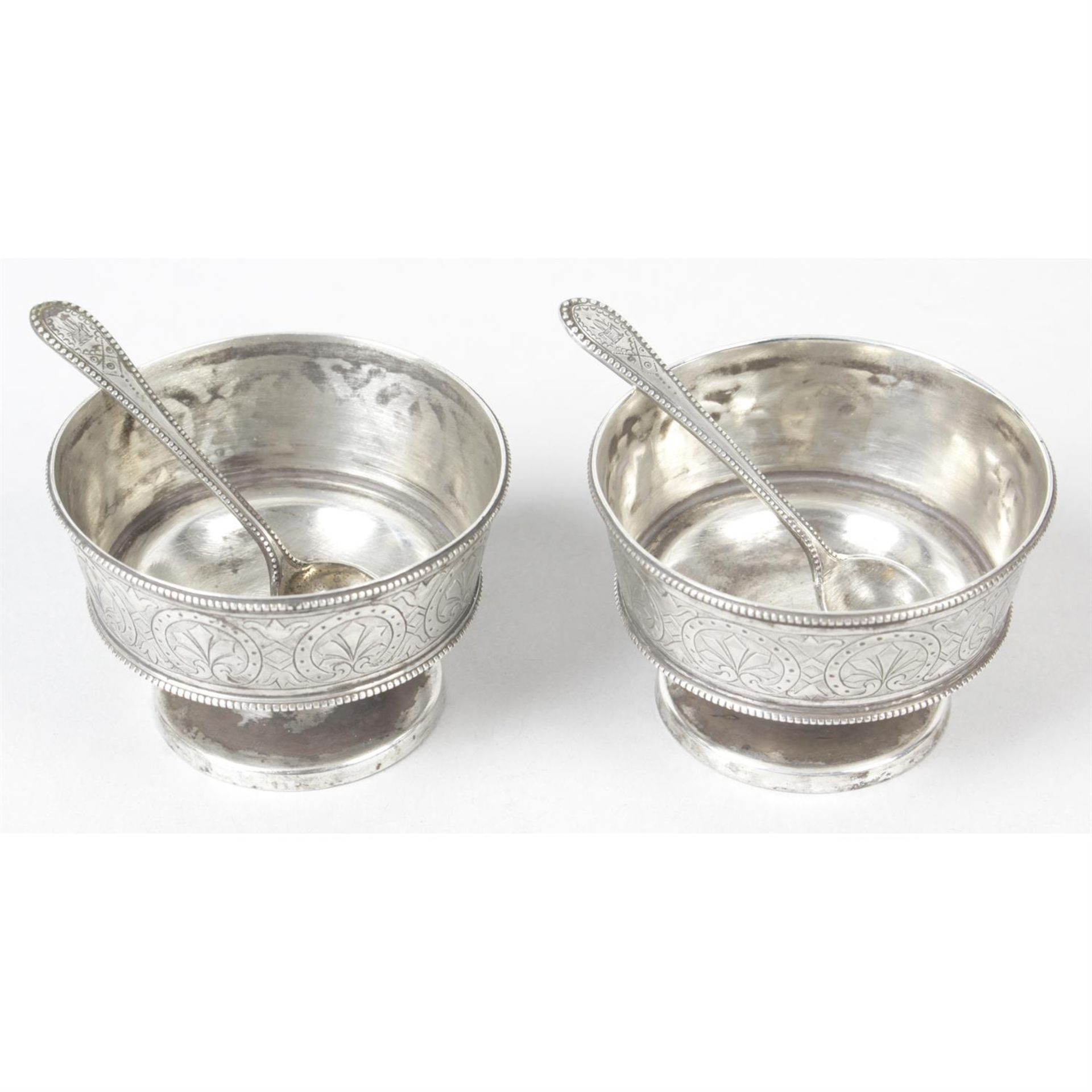 A pair of Victorian silver pedestal open salts with spoons.