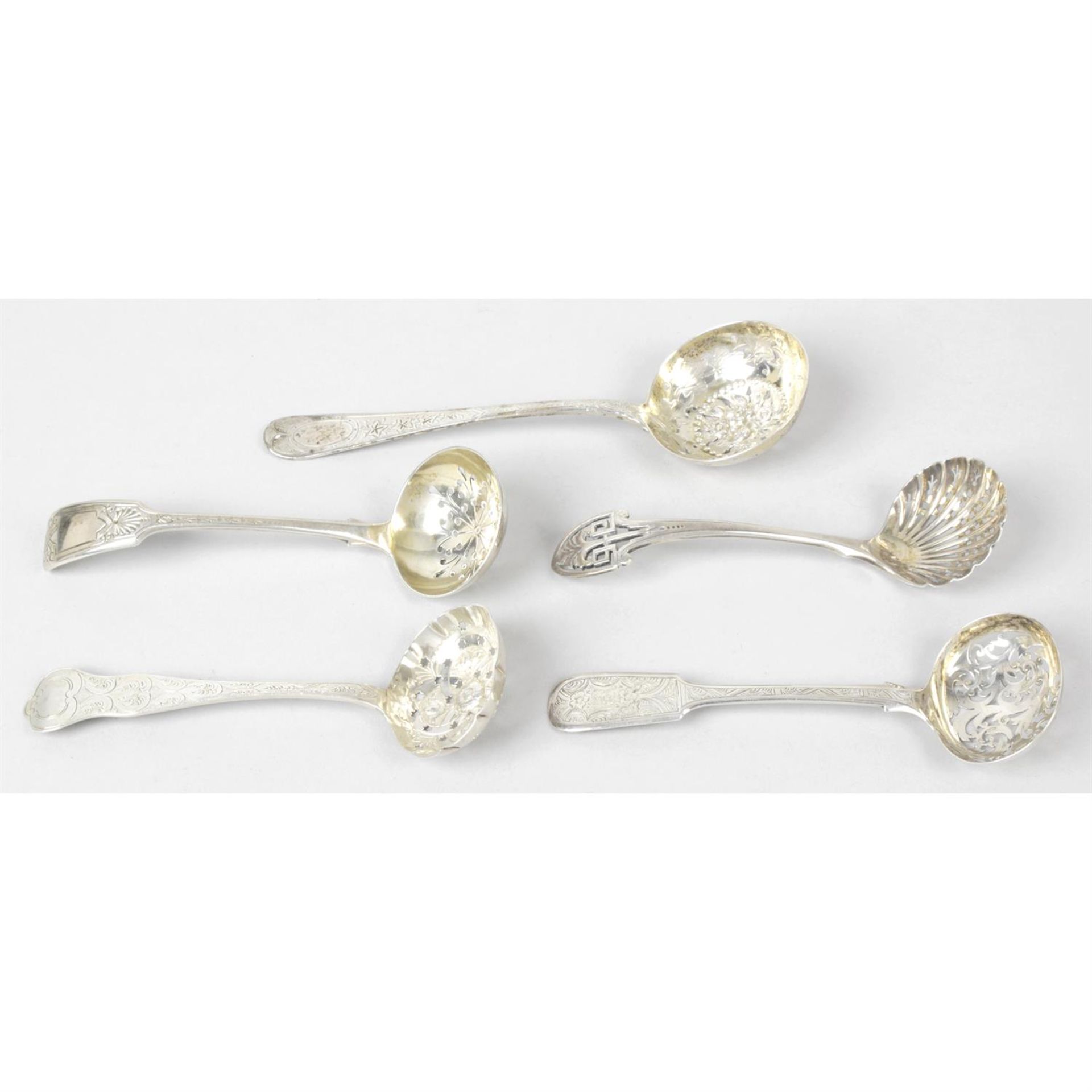 A William IV silver sifter spoon; together with four Victorian silver examples. (5).