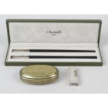 A mixed selection of assorted items to include a brass tobacco box, lighters, chopsticks, etc.