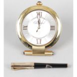 A Chopard travelling alarm clock and pen.