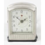 A mid twentieth century Telechron metal cased electronic alarm clock.