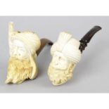 A carved meerschaum pipe, together with two similar examples.