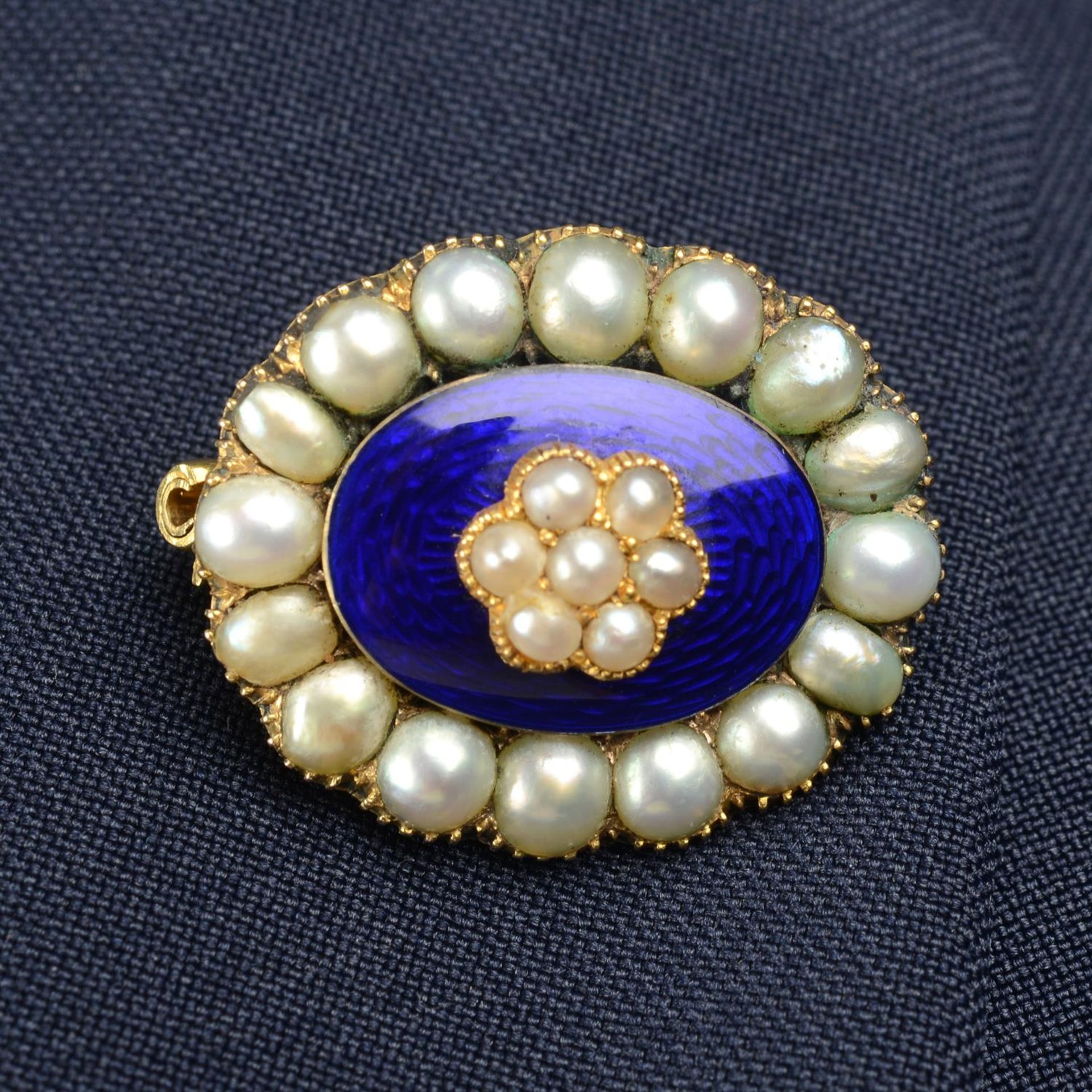 A late Georgian gold, split pearl and blue enamel mourning brooch.