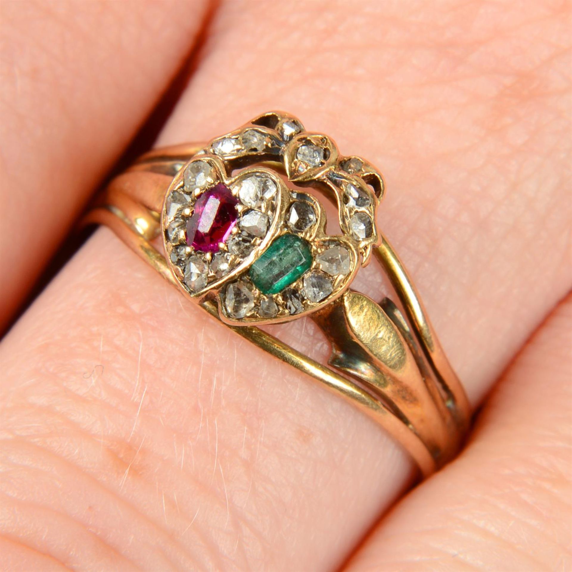 A late 19th century 15ct gold ruby, emerald and rose-cut diamond twinned hearts ring,