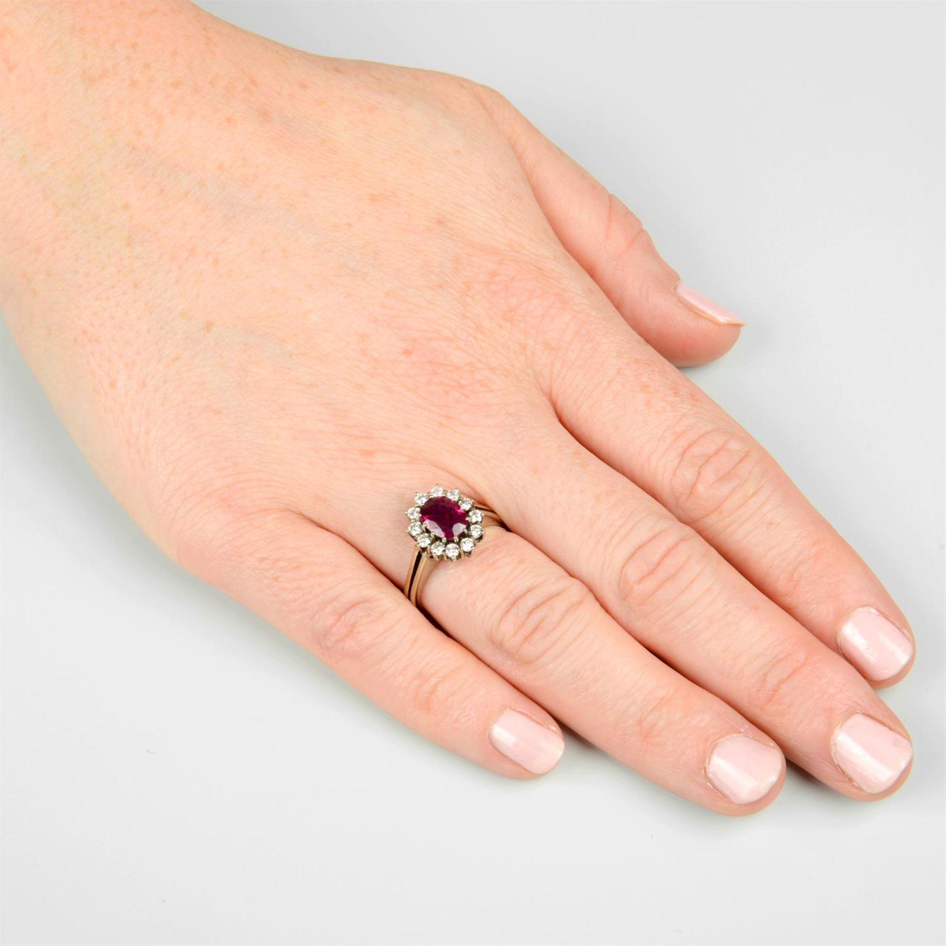 A ruby and brilliant-cut diamond cluster ring. - Image 5 of 5