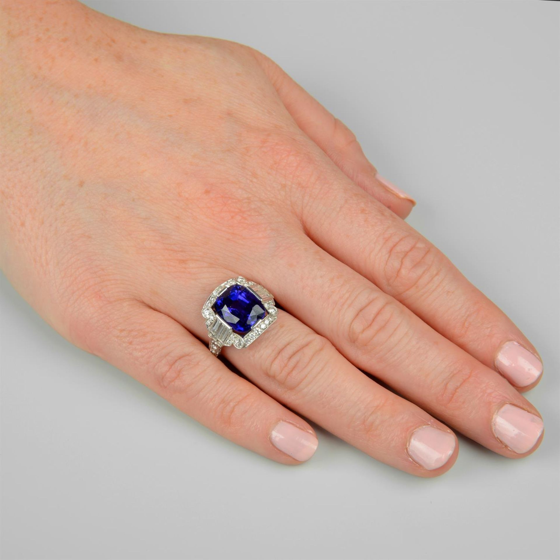 A tanzanite dress ring, with baguette and brilliant-cut diamond surround. - Image 5 of 5