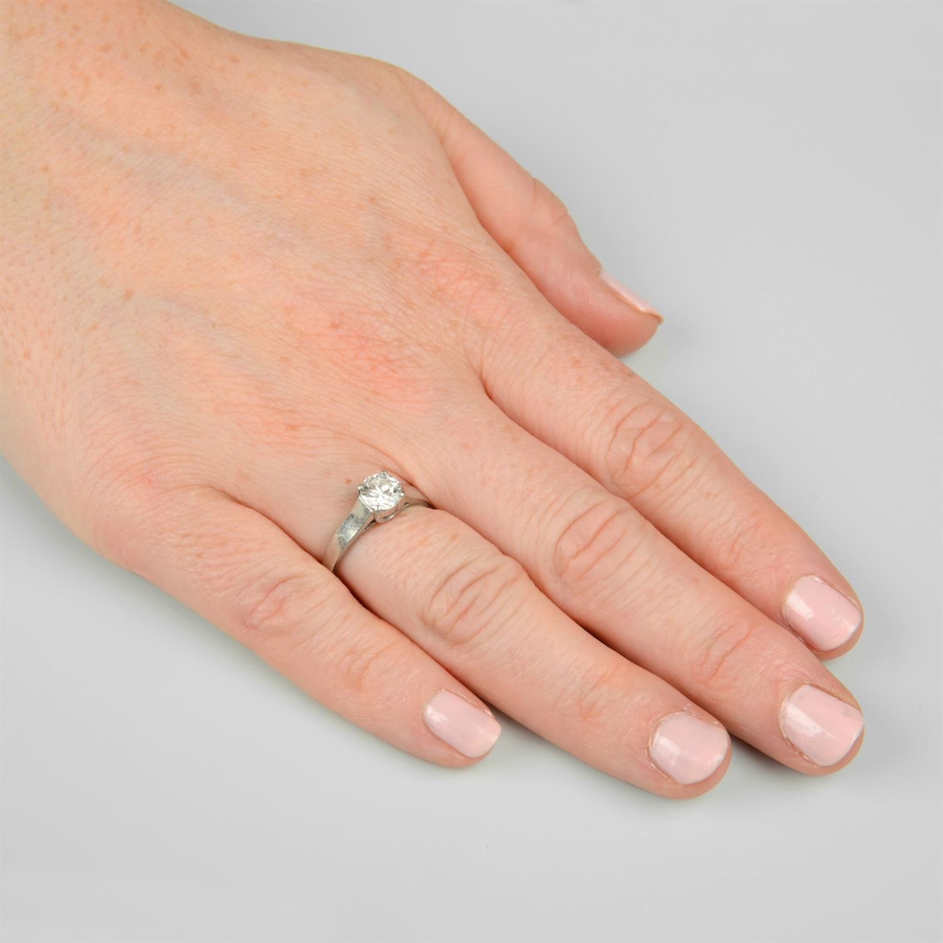 A platinum brilliant-cut diamond single-stone ring. - Image 5 of 5