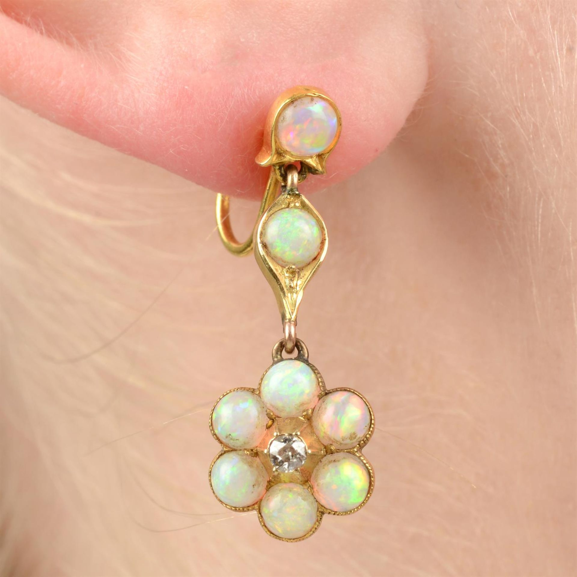 A pair of early 20th century 9ct gold opal and old-cut diamond floral drop earrings.