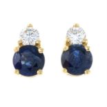 A pair of sapphire and diamond earrings.