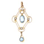 An early 20th century 9ct gold aquamarine split pearl openwork pendant.