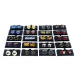 Twenty pairs of boxed cufflinks, most signed by Paul Smith.