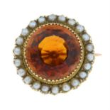 An early 20th century 15ct gold citrine and split pearl brooch.