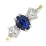 A sapphire and diamond three-stone ring.