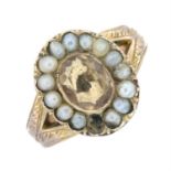 An early 20th century 9ct gold citrine and split pearl ring.