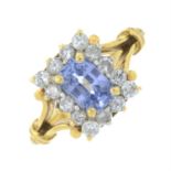 A sapphire and brilliant-cut diamond cluster ring.
