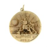 A 1970s 9ct gold 'First Man on the Moon' pendant, commemorating the Apollo 11 mission.