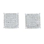 A pair of pave-set diamond stud earrings.