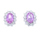 A pair of 18ct gold pink sapphire and diamond cluster earrings.