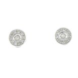 A pair of diamond cluster stud earrings.