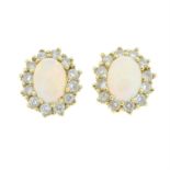 A pair of brilliant-cut diamond and opal cluster stud earrings.