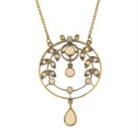 An early 20th century 9ct gold opal drop pendant, on an integral trace-link chain.