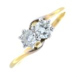 An 18ct gold brilliant-cut diamond two-stone crossover ring.