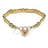 An early 20th century 9ct gold gate-link bracelet, with heart padlock clasp.