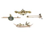 Four early 20th century gold gem-set brooches.