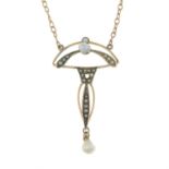 An early 20th century 9ct gold pearl and split pearl drop pendant, on an integral trace-link chain.