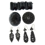 A selection of five late Victorian pieces of jet and bog oak jewellery.