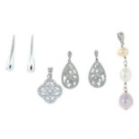 Two pairs of gem-set earrings and two pendants.