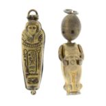 A sarcophagus charm together with a fumsup charm.