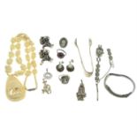 A selection of jewellery and a bone necklace.