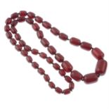 A graduated plastic bead necklace.