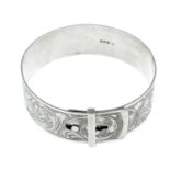 A silver engraved floral motif buckle bangle.