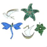 Four early to mid 20th century silver and enamel brooches and a pendant.