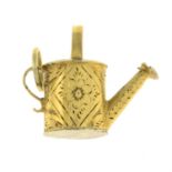 A 19th century gold watering can charm.