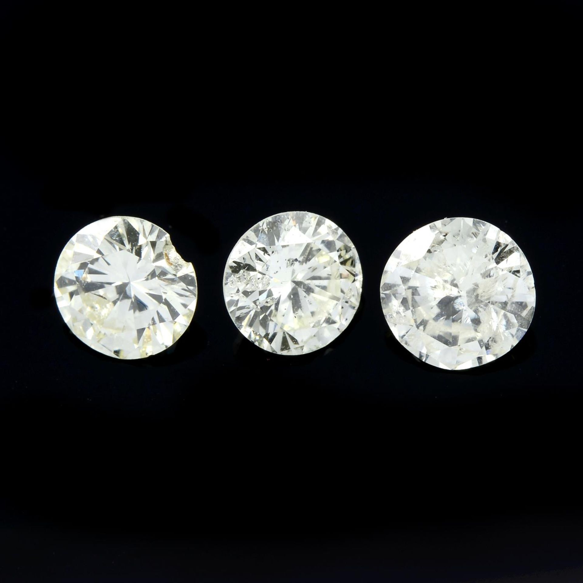 Three brilliant-cut diamonds, weighing 1.04ct. Estimated to be tinted colour and I clarity