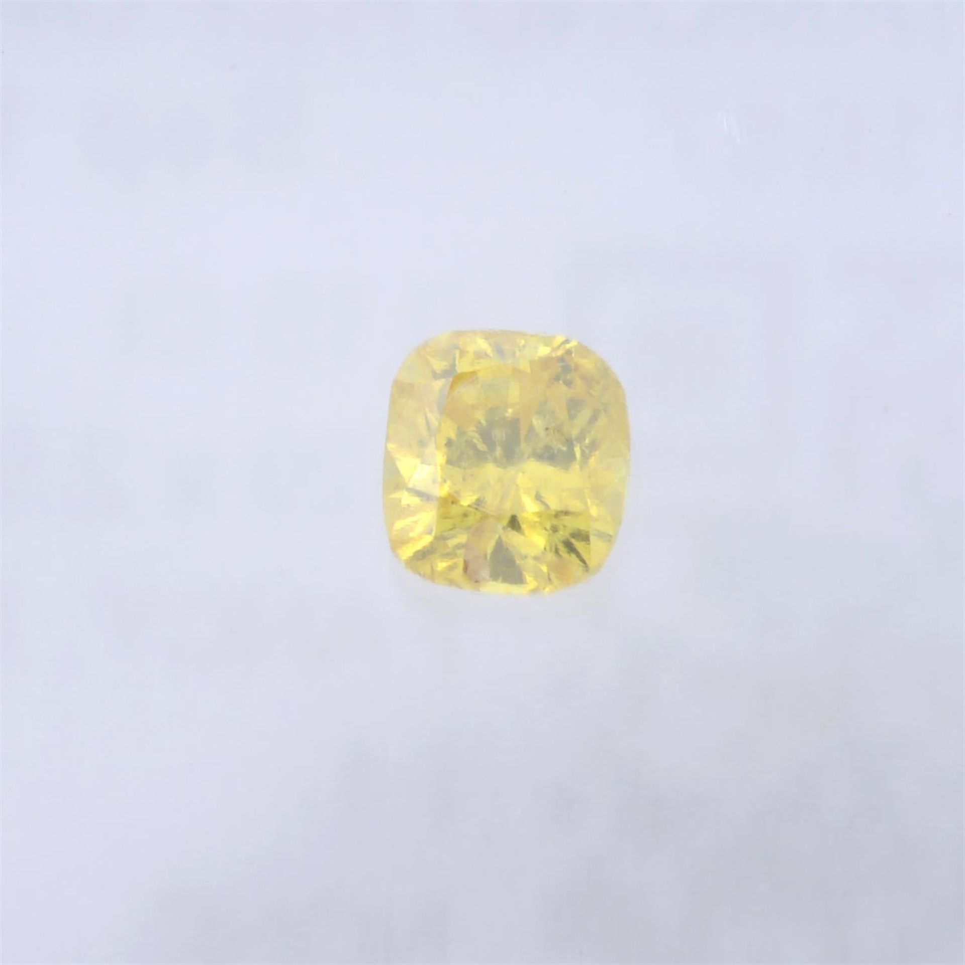 A cushion cut fancy vivid orangy yellow diamond, weighing 0.15ct. Within IGI security seal - Image 2 of 4