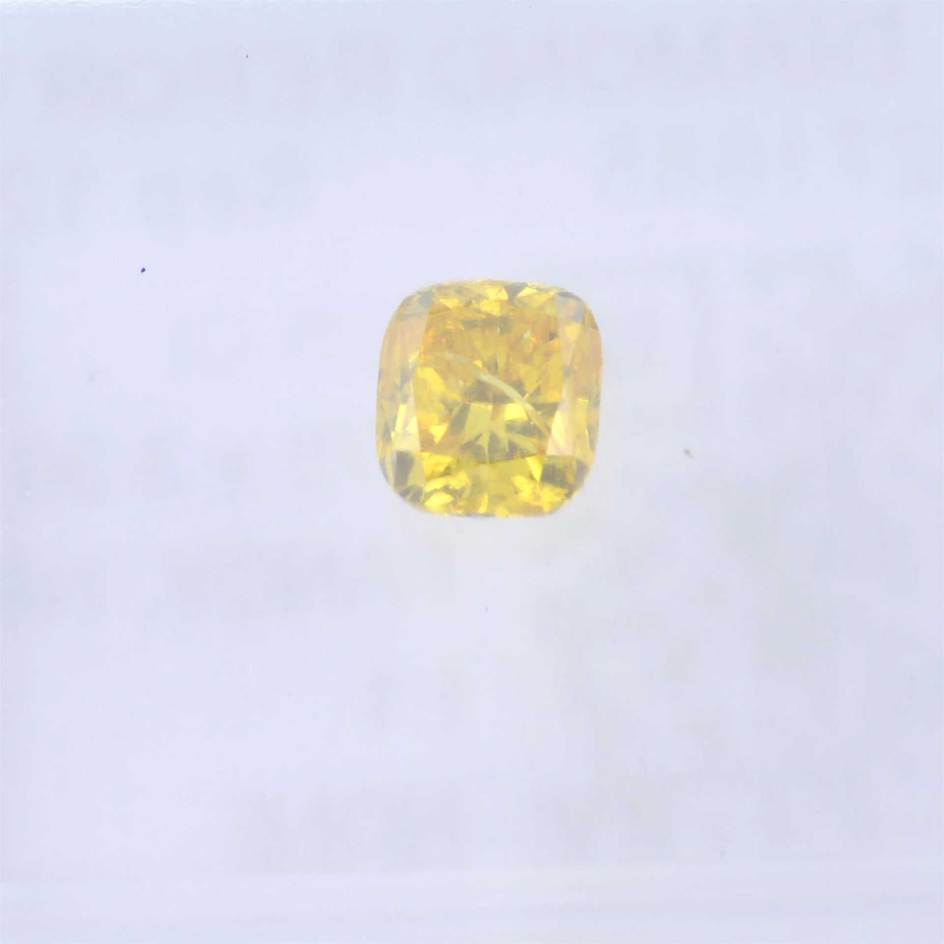 A cushion cut fancy vivid orangy yellow diamond, weighing 0.25ct. Within IGI security seal - Image 2 of 4