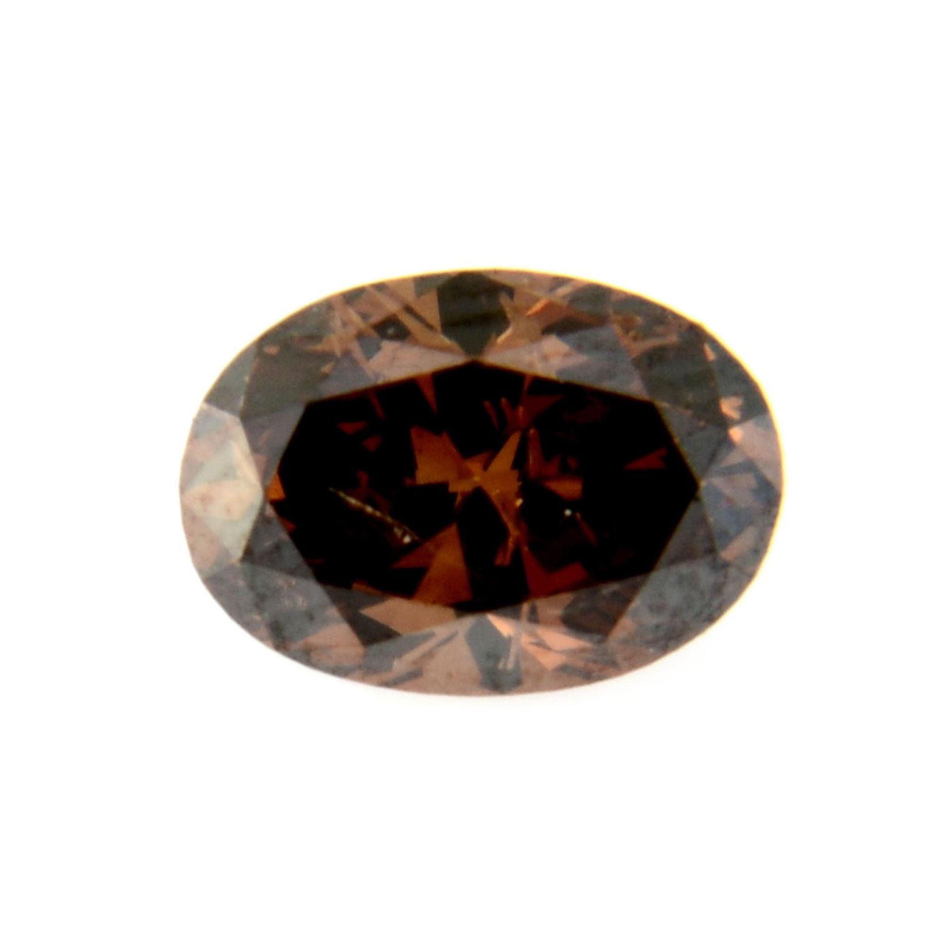 An oval shape 'brown' diamond, weighing 1.03ct. Estimated to be 'brown' colour and I1 clarity