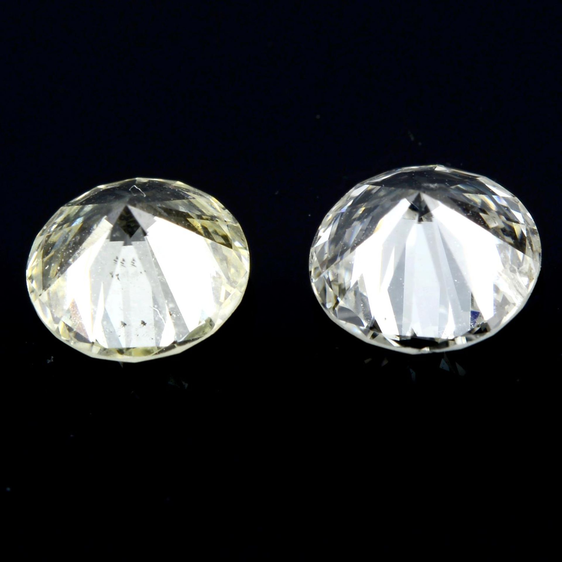 A pair of brilliant-cut diamonds, weighing 1.03ct. Estimated to be tinted colour and I1 clarity and - Image 2 of 2