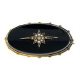 A late Victorian split pearl and onyx mourning brooch.