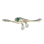 An Art Nouveau emerald and diamond brooch.